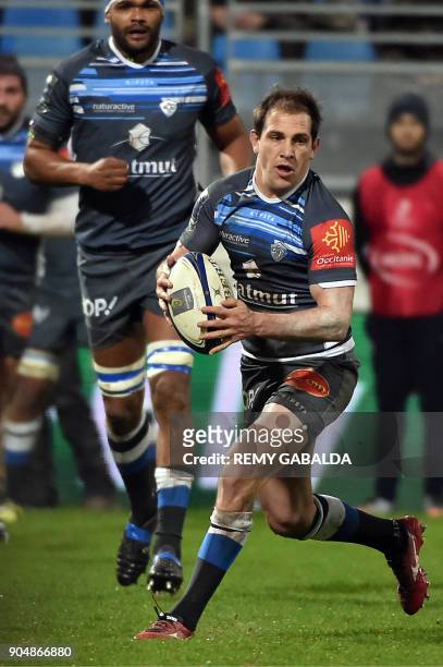 Castres' fly half Ben Urdapilleta runs with the ball during the European Champions Cup rugby union match between Castres Olympique and Leicester...