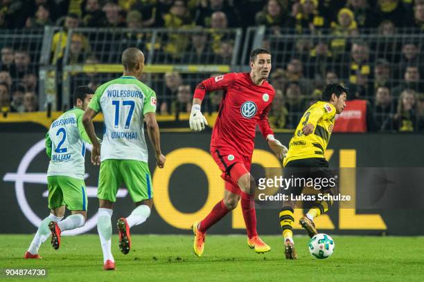 Goalkeeper Koen Casteels of Wolfsburg in action against Shinji Kagawa of Dortmund during the Bundesliga match between Borussia Dortmund and VfL...