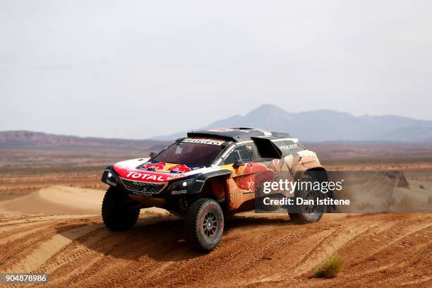 Carlos Sainz of Spain and Peugeot Total drives with co-driver Lucas Cruz of Spain in the 3008 DKR Peugeot car in the Classe : T1.4 2 Roues Motrices,...