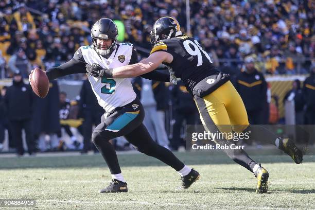 Blake Bortles of the Jacksonville Jaguars attempts to break a tackle from T.J. Watt of the Pittsburgh Steelers during the first half of the AFC...