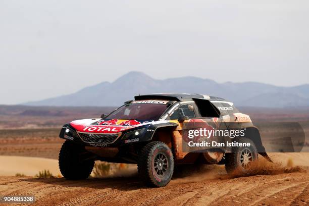 Carlos Sainz of Spain and Peugeot Total drives with co-driver Lucas Cruz of Spain in the 3008 DKR Peugeot car in the Classe : T1.4 2 Roues Motrices,...