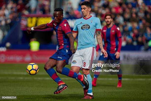 Boateng of Levante UD competes for the ball with Pablo Hernandez of Real Club Celta de Vigo during the La Liga game between Levante UD and Real Club...