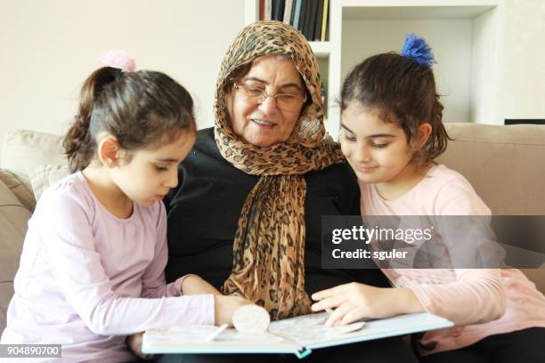 grandmother and granddaughters - turkish ethnicity stock pictures, royalty-free photos & images