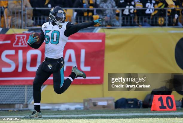 Telvin Smith of the Jacksonville Jaguars reacts after recovering a fumble and returning it for a 50 yard touchdown in the second quarter during the...