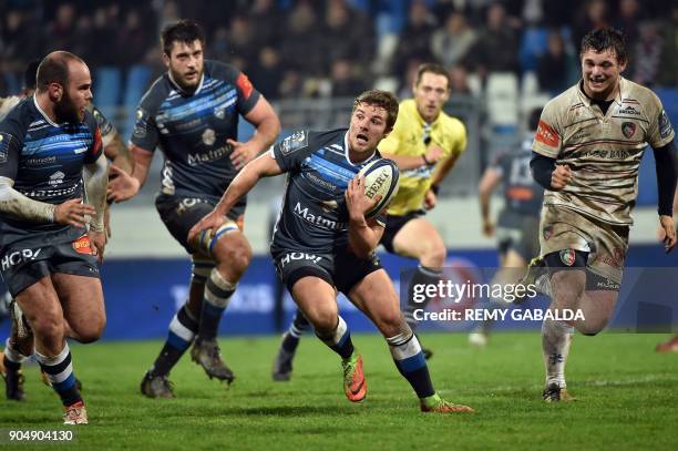 Castres's player Yohan Domenech runs with the ball during the European Champions Cup rugby union match between Castres Olympique and Leicester...