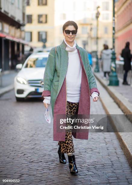 Caroline Issa wearing leopard print pants, green checked coat is seen outside MSGM during Milan Men's Fashion Week Fall/Winter 2018/19 on January 14,...