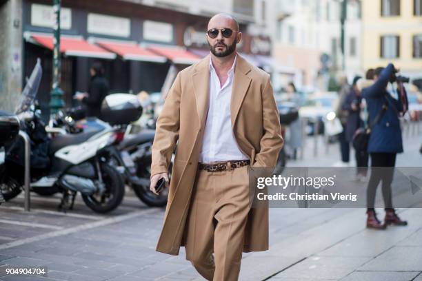 Milan Vukmirovic wearing beige wool coat and pants is seen outside MSGM during Milan Men's Fashion Week Fall/Winter 2018/19 on January 14, 2018 in...