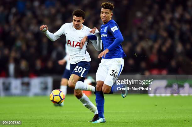 Tottenham Hotspur's Dele Alli battles with Everton's Mason Holgate during the Premier League match between Tottenham Hotspur against Everton at...
