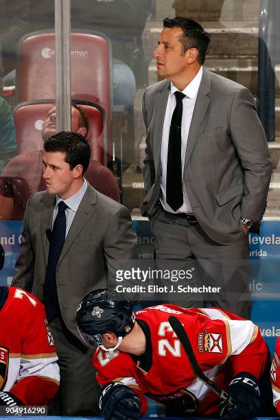 Florida Panthers Head Coach Bob Boughner stands on the bench to get a better view along with Assistant Coach Paul McFarland against the Calgary...