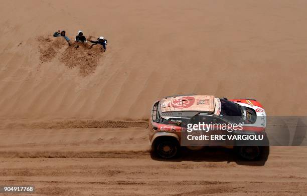 Sheikh Khalid Al Qassimi of United Arab Emirates, with his co-driver Xavier Panseri of France, steers his Peugeot during Stage 8 of the 2018 Dakar...