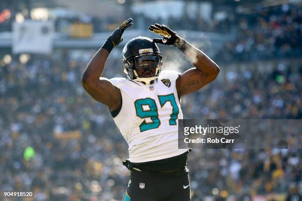 Malik Jackson of the Jacksonville Jaguars celebrates against the Pittsburgh Steelers during the first half of the AFC Divisional Playoff game at...