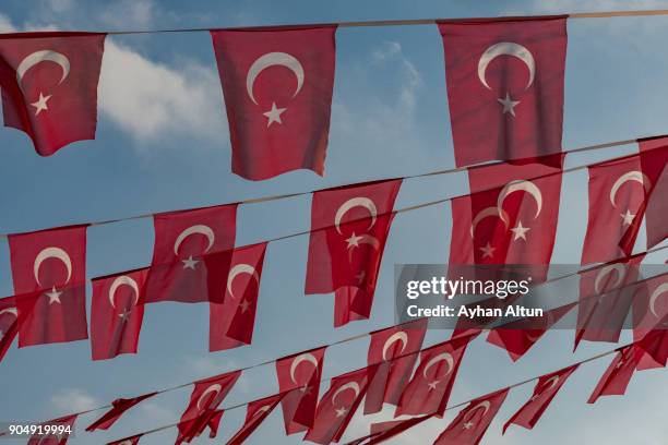 turkish flags against the sky - bandera turca fotografías e imágenes de stock