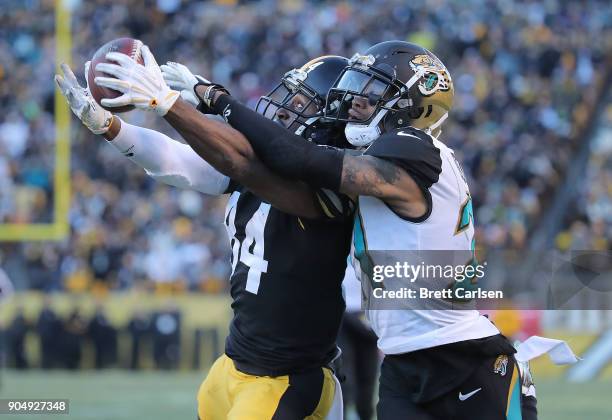 Antonio Brown of the Pittsburgh Steelers makes a catch while being defended by A.J. Bouye of the Jacksonville Jaguars for a 43 yard touchdown...