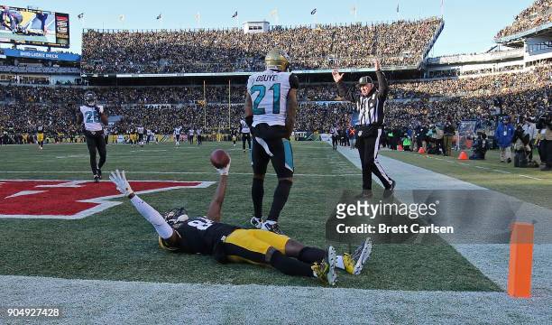 Antonio Brown of the Pittsburgh Steelers reacts after a 43 yard touchdown reception in the fourth quarter during the AFC Divisional Playoff game...