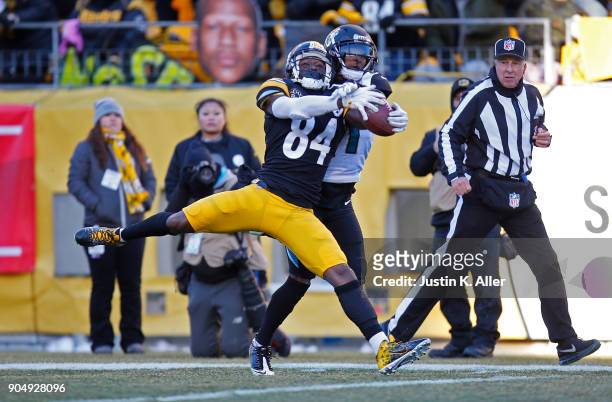 Antonio Brown of the Pittsburgh Steelers makes a catch while being defended by A.J. Bouye of the Jacksonville Jaguars for a 43 yard touchdown...