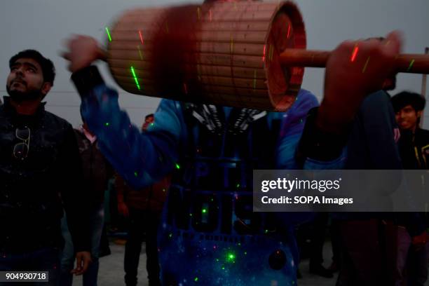 Bangladeshi boy during flying kites as a part of celebration of Shakrain Festival which held in southern part of the capital Dhaka , Bangladesh.The...