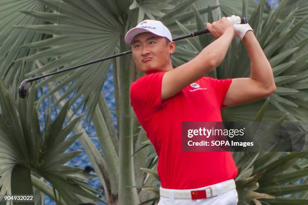 Li Haotong is seen having a shot on the last day at EurAsia Cup 2018. EurAsia Cup is a biennial men professional team golf tournament between Europe...