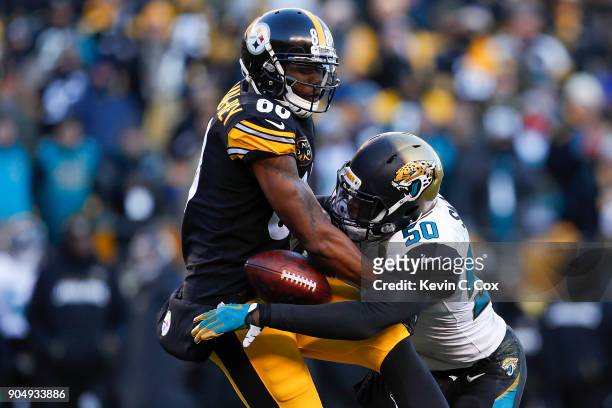 Telvin Smith of the Jacksonville Jaguars hits Darrius Heyward-Bey of the Pittsburgh Steelers during the second half of the AFC Divisional Playoff...