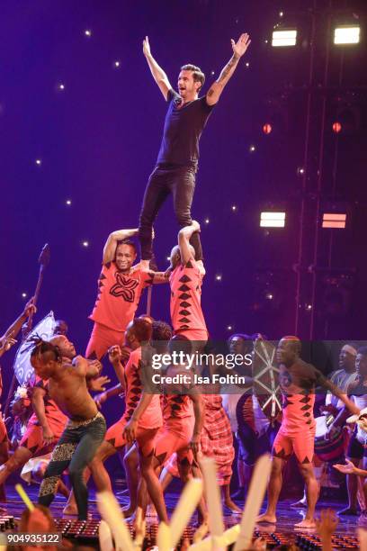 The ensemble Afrika! Afrika! and German singer and presenter Florian Silbereisen perform at the 'Schlagerchampions - Das grosse Fest der Besten' TV...