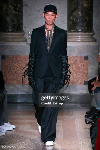 Model walks the runway at the Les Hommes show during Milan Men's Fashion Week Fall/Winter 2018/19 on January 13, 2018 in Milan, Italy.