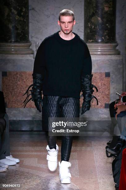 Model walks the runway at the Les Hommes show during Milan Men's Fashion Week Fall/Winter 2018/19 on January 13, 2018 in Milan, Italy.