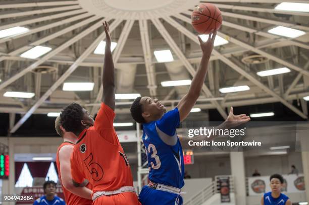 Academy Ascenders forward Jaylen Sebree shoots a reverse layup during the first half of the Spalding Hoophall Classic high school basketball game...