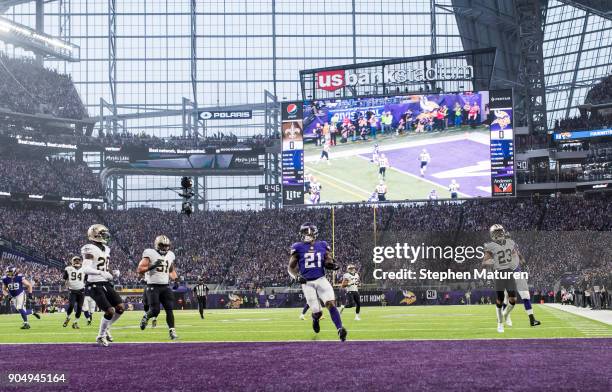 Jerick McKinnon of the Minnesota Vikings scores a 14 yard rushing touchdown in the first quarter of the NFC Divisional Playoff game against the New...