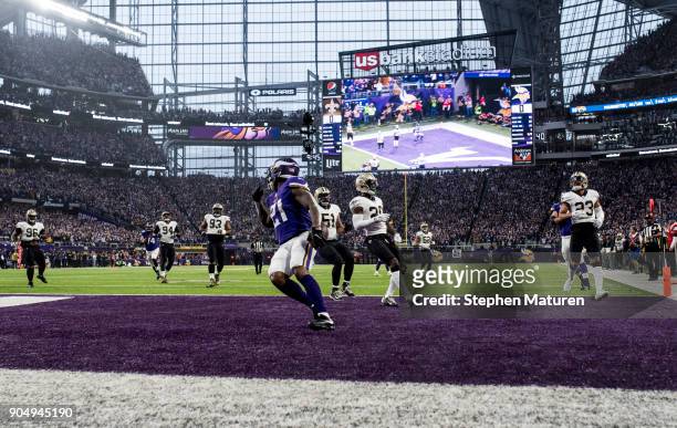 Jerick McKinnon of the Minnesota Vikings scores a 14 yard rushing touchdown in the first quarter of the NFC Divisional Playoff game against the New...