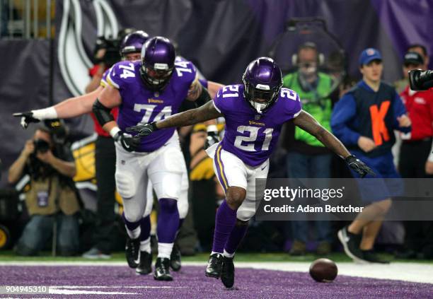 Jerick McKinnon of the Minnesota Vikings celebrates after scoring a 14 yard rushing touchdown in the first quarter of the NFC Divisional Playoff game...