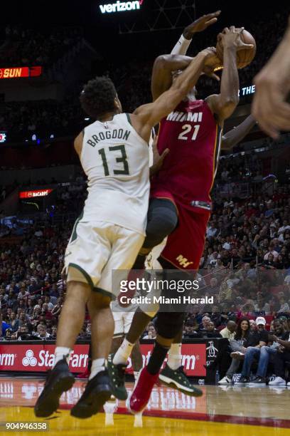 Miami Heat center Hassan Whiteside is fouled by Milwaukee Bucks Malcolm Brogdon in the second quarter on Sunday, Jan. 14, 2018 at the...