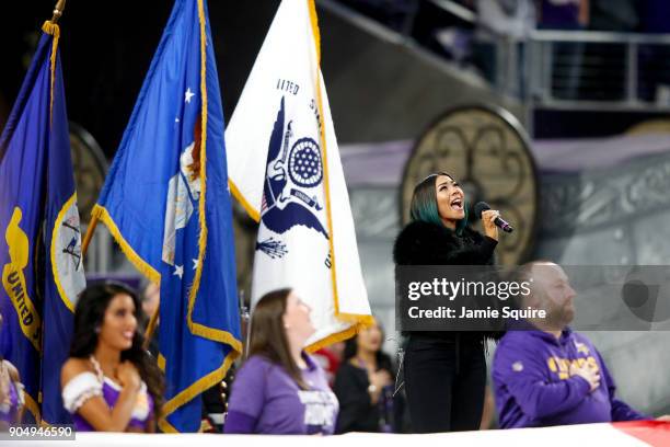 Singer Bridget Kelly sings the national anthem prior to the NFC Divisional Playoff game between the Minnesota Vikings and the New Orleans Saints at...