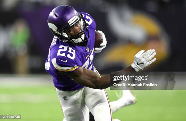 Latavius Murray of the Minnesota Vikings carries the ball in the first quarter of the NFC Divisional Playoff game against the New Orleans Saints on...