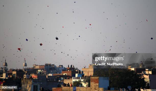 People flying kites on the occasion of Makar Sakranti at wall city of Jaipur, Rajasthan,India on 14 January 2018.