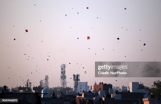 People flying kites on the occasion of Makar Sakranti at wall city of Jaipur, Rajasthan,India on 14 January 2018.