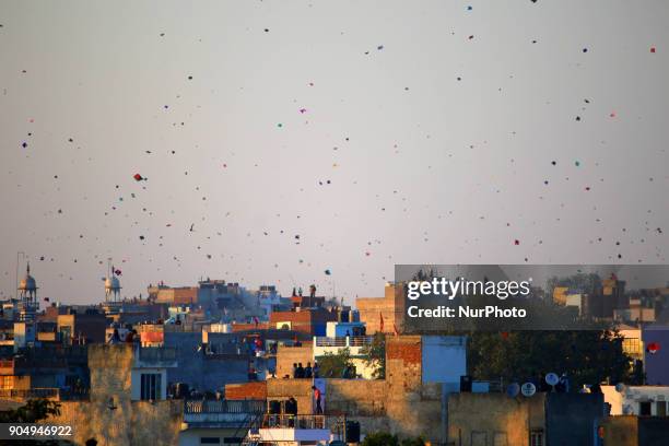 People flying kites on the occasion of Makar Sakranti at wall city of Jaipur, Rajasthan,India on 14 January 2018.