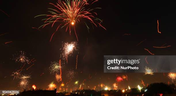 Fireworks after people flying kites on the occasion of Makar Sakranti at wall city of Jaipur, Rajasthan,India on 14 January 2018.