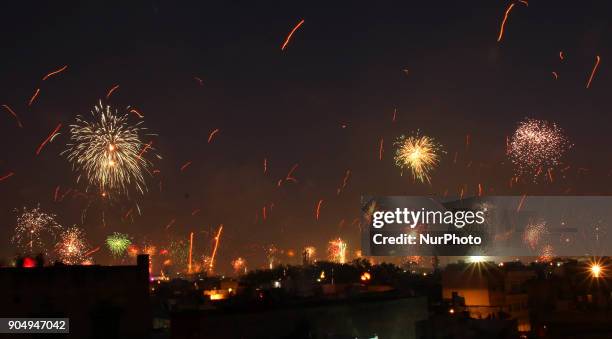 Fireworks after people flying kites on the occasion of Makar Sakranti at wall city of Jaipur, Rajasthan,India on 14 January 2018.