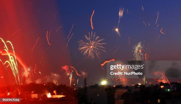 Fireworks after people flying kites on the occasion of Makar Sakranti at wall city of Jaipur, Rajasthan,India on 14 January 2018.