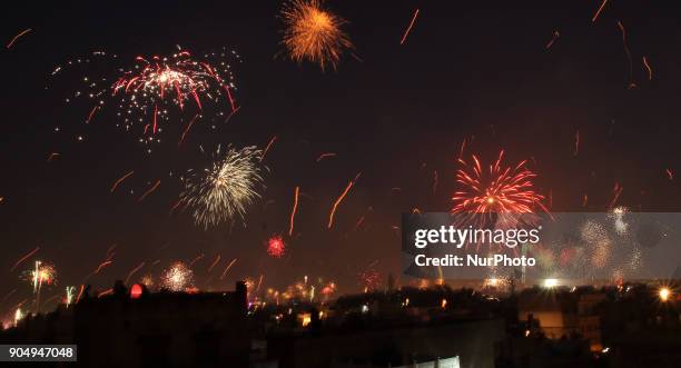 Fireworks after people flying kites on the occasion of Makar Sakranti at wall city of Jaipur, Rajasthan,India on 14 January 2018.