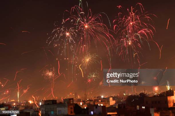 Fireworks after people flying kites on the occasion of Makar Sakranti at wall city of Jaipur, Rajasthan,India on 14 January 2018.