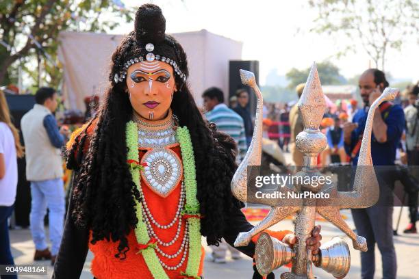 An Indian dressup artist of ' Lord Shiva' during the Kite Festival on the occasion of Makar Sakranti at Jal Mahal of Jaipur, Rajasthan,India on 14...