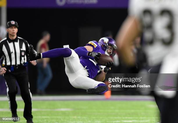 Andrew Sendejo of the Minnesota Vikings intercepts the ball in the first quarter of the NFC Divisional Playoff game against the New Orleans Saints on...