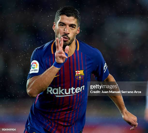 Luis Suarez of FC Barcelona celebrates after scoring his team's third goal during the La Liga match between Real Sociedad and FC Barcelona at Estadio...
