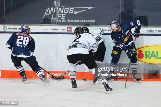 Oliver Mebus of Nuernberg Ice Tigers vies Frank Mauer of Red Bull Munich during 42th Gameday of German Ice Hockey League between Red Bull Munich and...