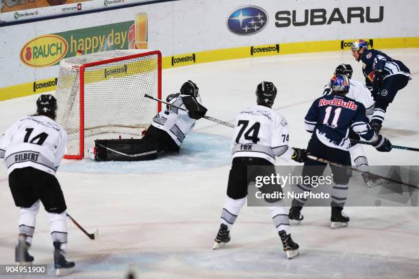 Brooks Macek of Red Bull Munich scores during 42th Gameday of German Ice Hockey League between Red Bull Munich and Nuernberg Ice Tigers at...