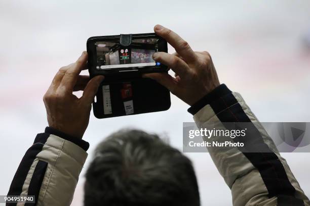 Visitor photograpfs the scoreboard during 42th Gameday of German Ice Hockey League between Red Bull Munich and Nuernberg Ice Tigers at...