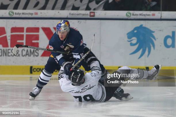 Jason Jaffray of Red Bull Munich vies John Mitchell of Nuernberg Ice Tigers during 42th Gameday of German Ice Hockey League between Red Bull Munich...