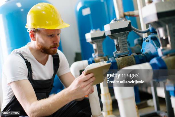 factory worker with tablet - pvc stock pictures, royalty-free photos & images