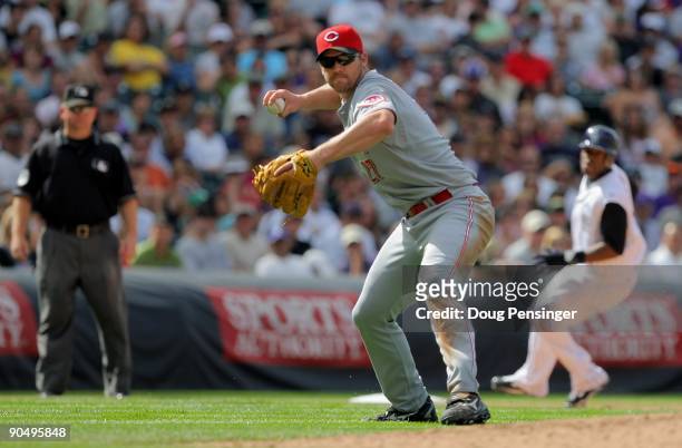 Third baseman Scott Rolen of the Cincinnati Reds throws out a runner against the Colorado Rockies at Coors Field on September 7, 2009 in Denver,...