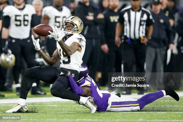 Ted Ginn of the New Orleans Saints makes a catch defended by Mackensie Alexander of the Minnesota Vikings during the first half of the NFC Divisional...